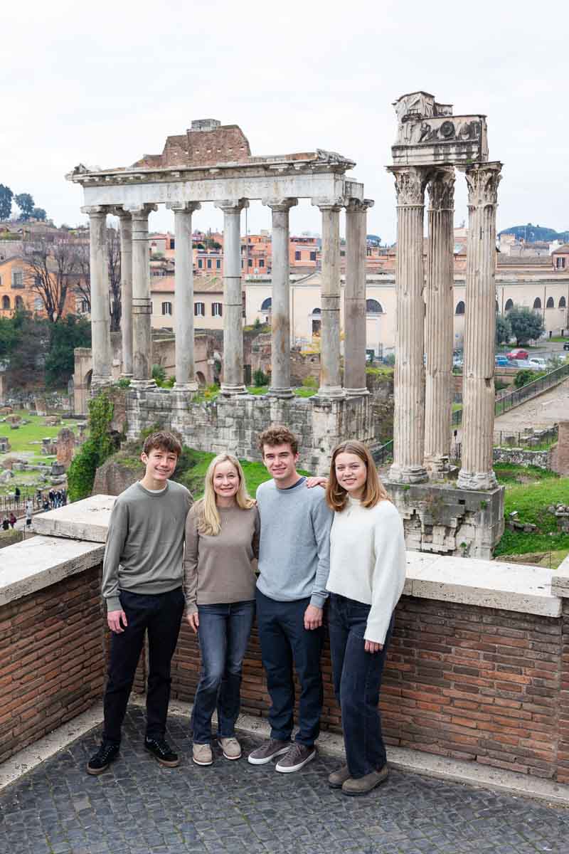 Family portrait pictures taken at the Roman Forum posing down in front of the ancient temples and monuments 