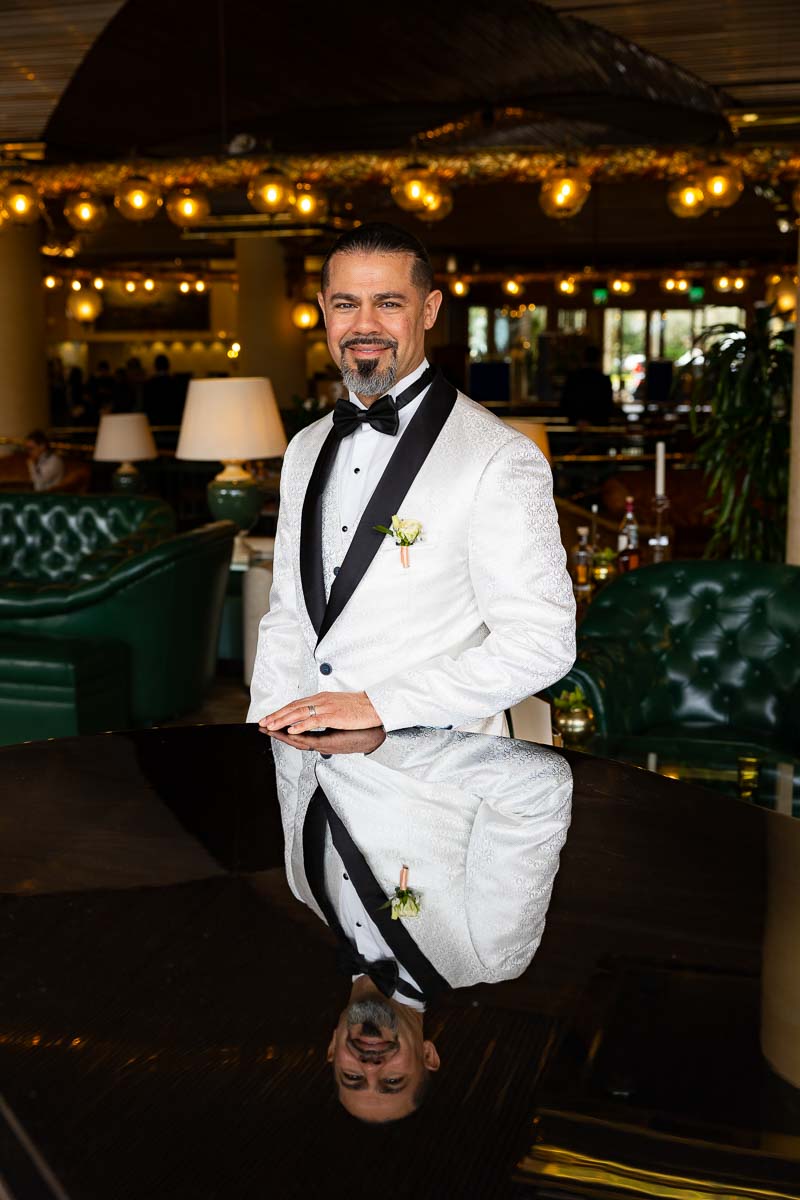 The groom taking a portrait picture during a wedding photoshoot to celebrate anniversary in Rome Italy