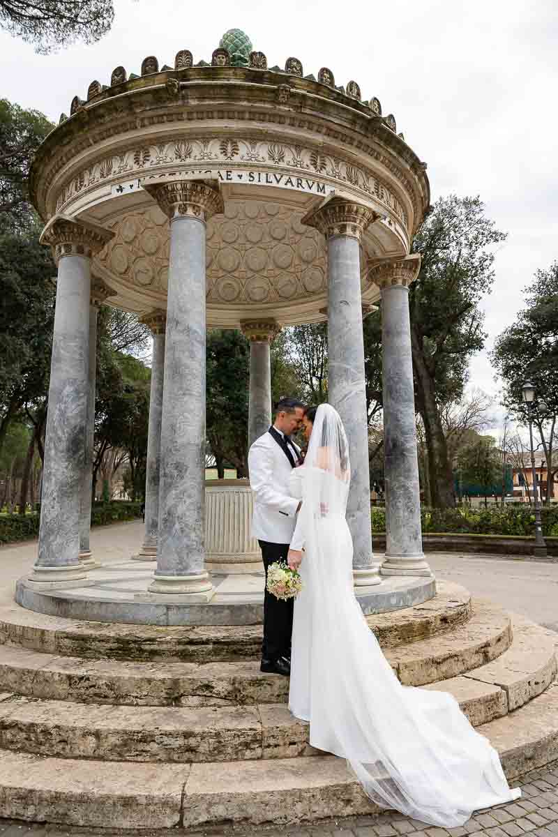 Newlyweds just renewed marriage and taking pictures at the Temple of Diana in Rome Italy