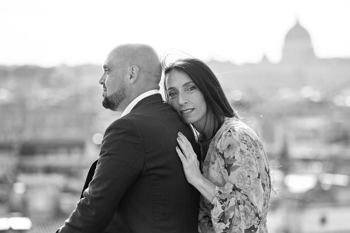 Black and white Surprise Engagement photography conversion of a couple posing during a Photo Shoot in Rome