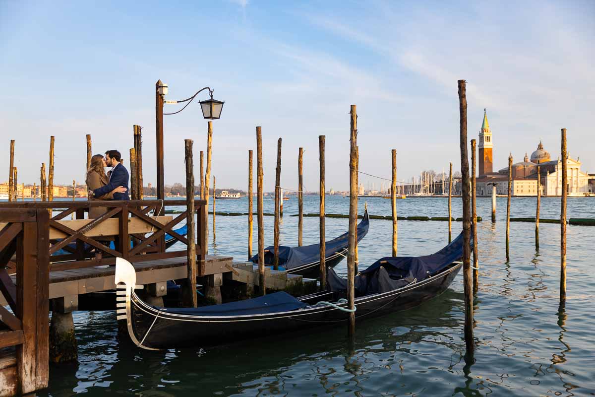 Couple photography among Venetian gondolas in Venice Italy