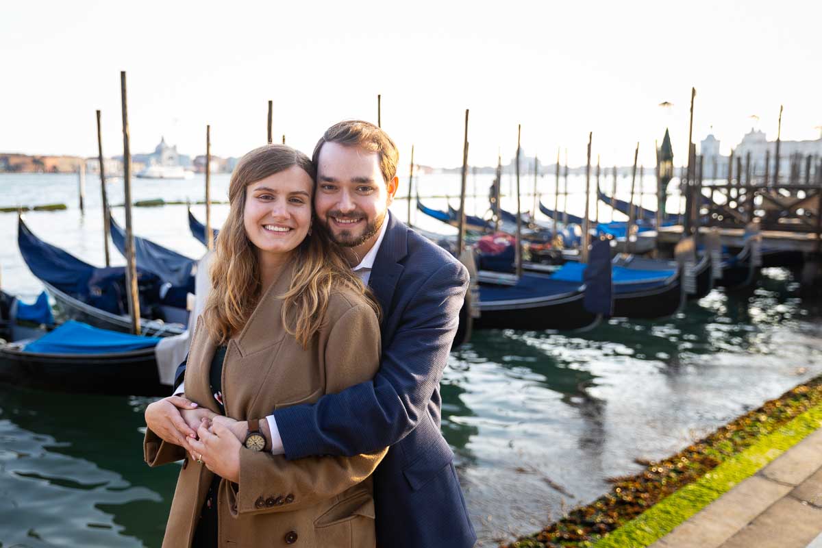 Couple portrait taken with rows of gondolas behind