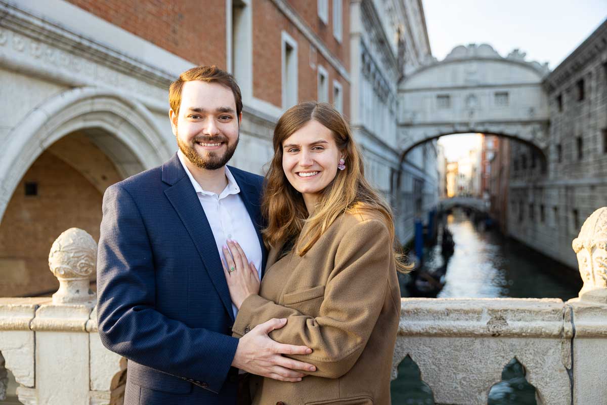 Taking pictures together by the bridge of Sighs