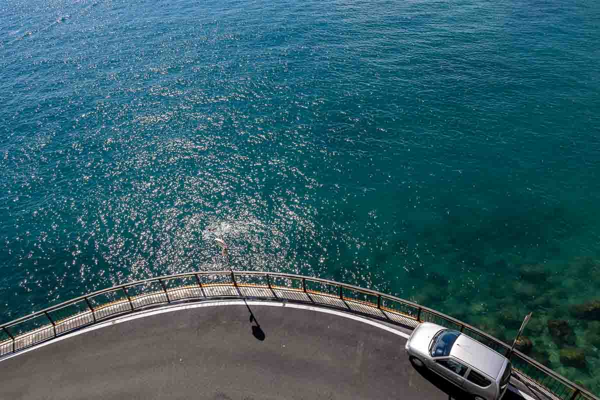 A roadside bend curve depicting a characteristic image of the Amalfi coast seen o n the road 