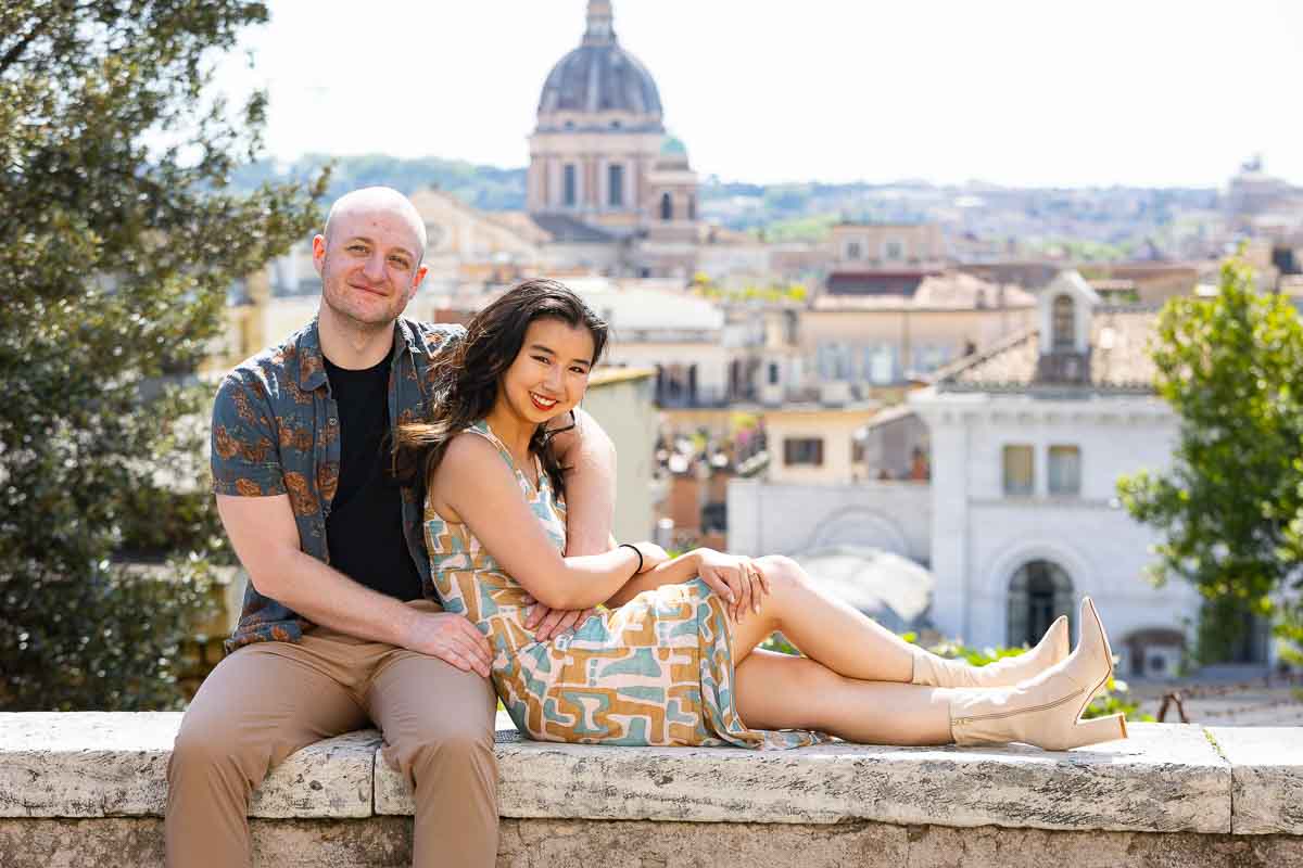 Couple photography session in the Eternal city smailing and facing the camera 