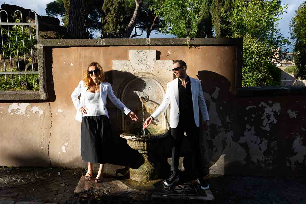 Having fun in front of an ancient roman water fountain