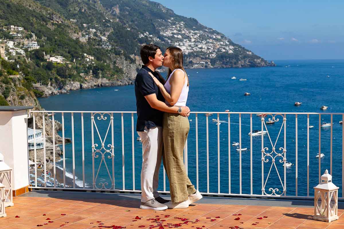 In love in Positano Italy after a surprise weddng proposal candidly photographed by a hidden photographer 