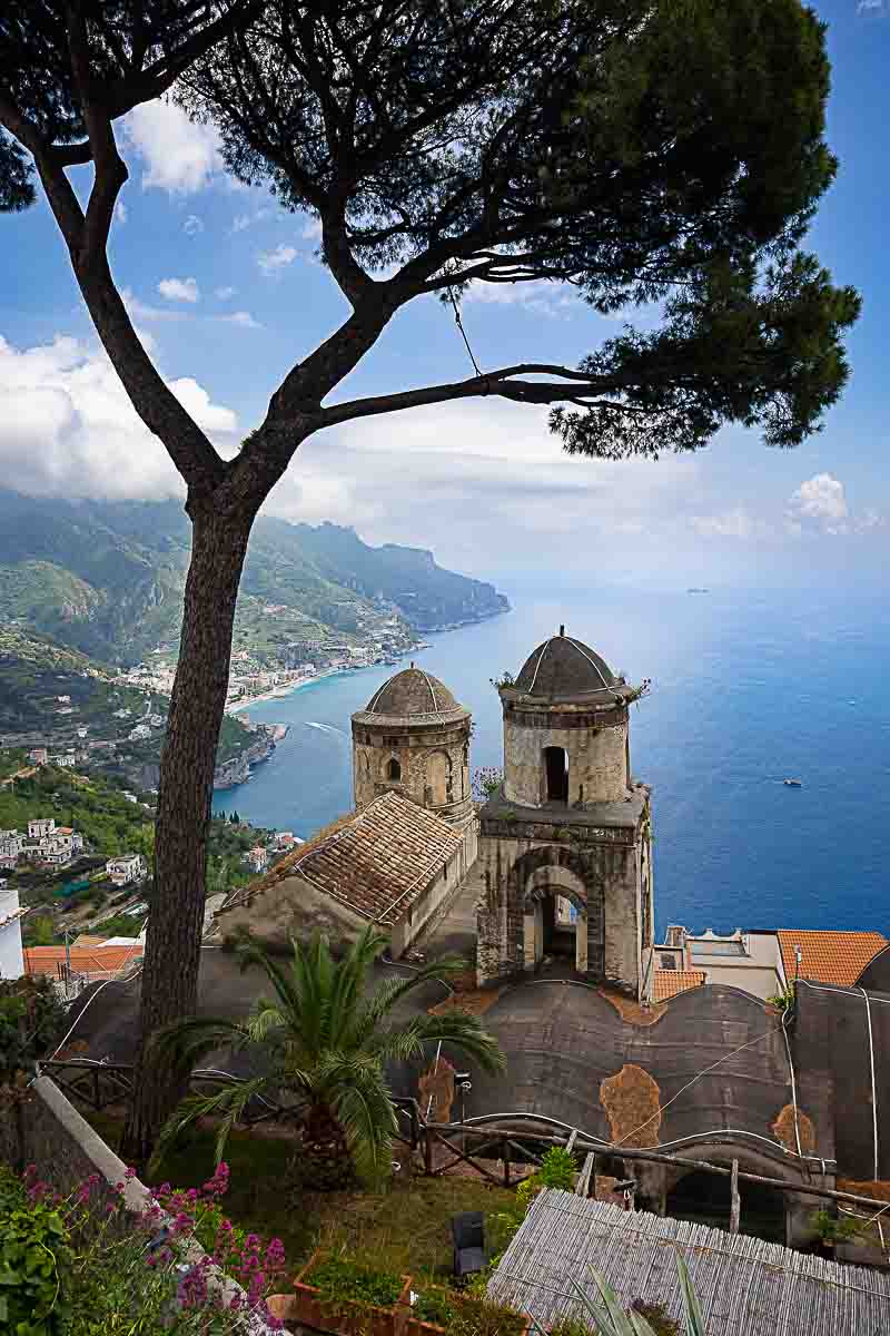 The view of the Moorish style cloister before the magnificent view of the Amalfi coast line viewed from the above Villa Cimbrone in Ravello Italy 