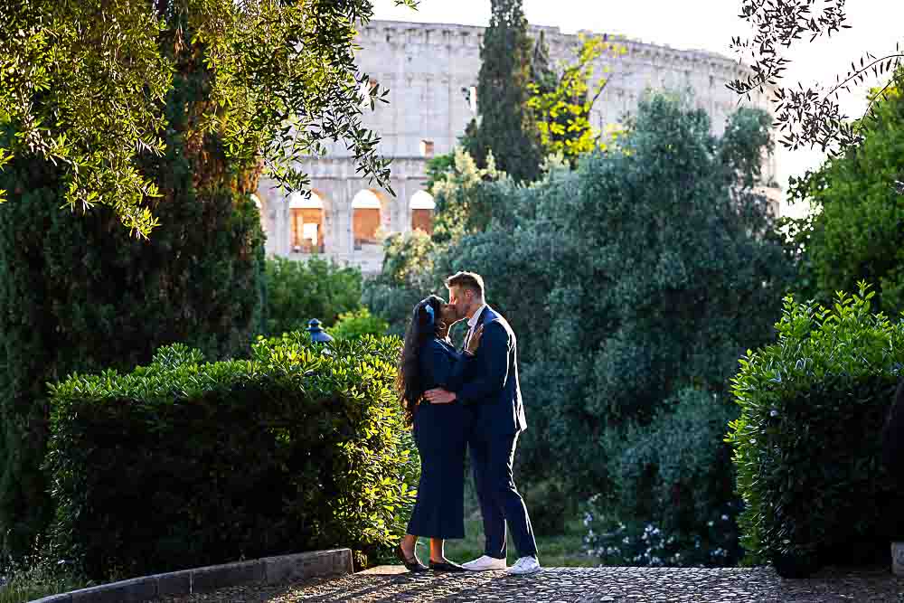 Couple kissing at the Roman Coliseum during a photography session 