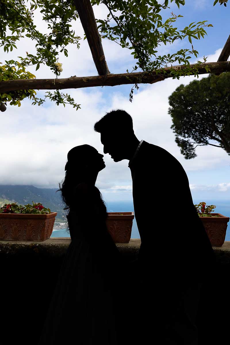 Silhouette image of couple getting closer to kiss 