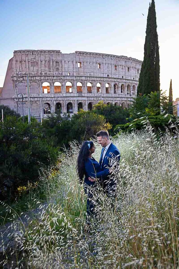 Posed among high grass with the major landmark in the background