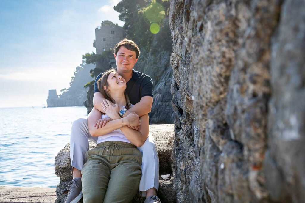 Portrait picture of a couple in love being posed during a photography session in Positano during a photoshoot
