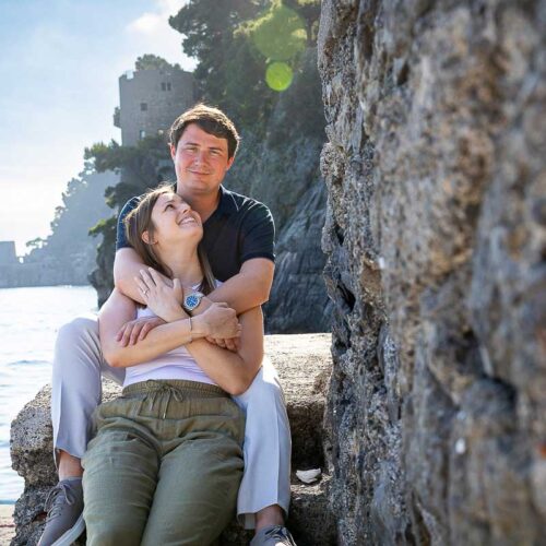 Portrait picture of a couple in love being posed during a photography session in Positano during a photoshoot