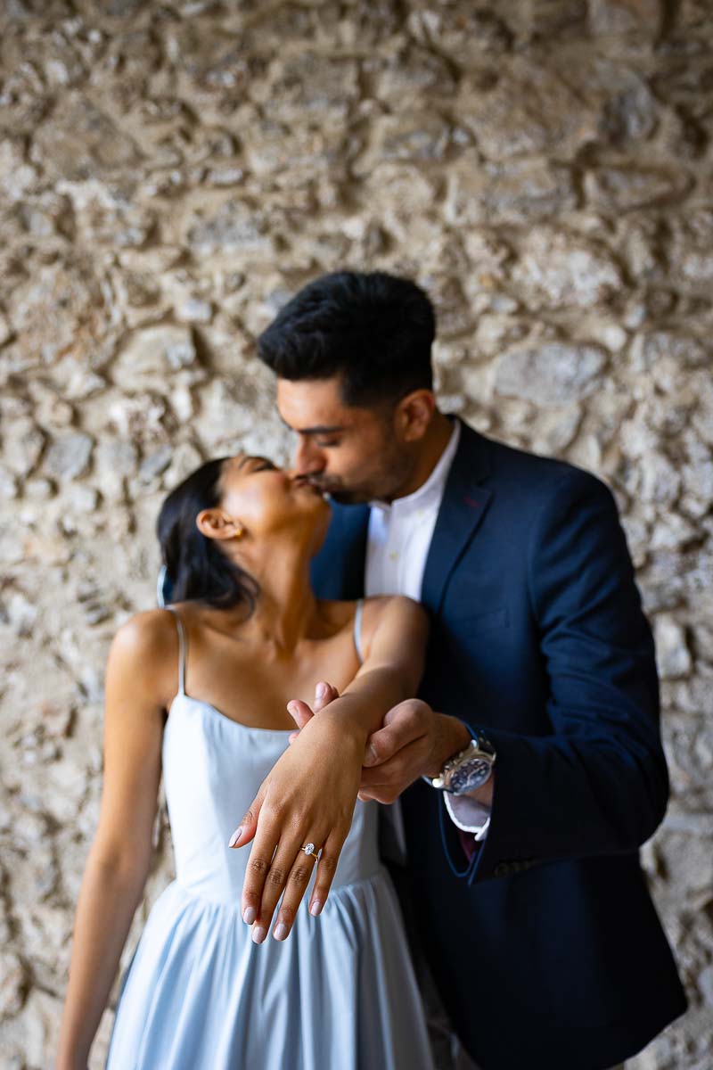 Couple portrait picture taken up close while showing the amazing engagement ring