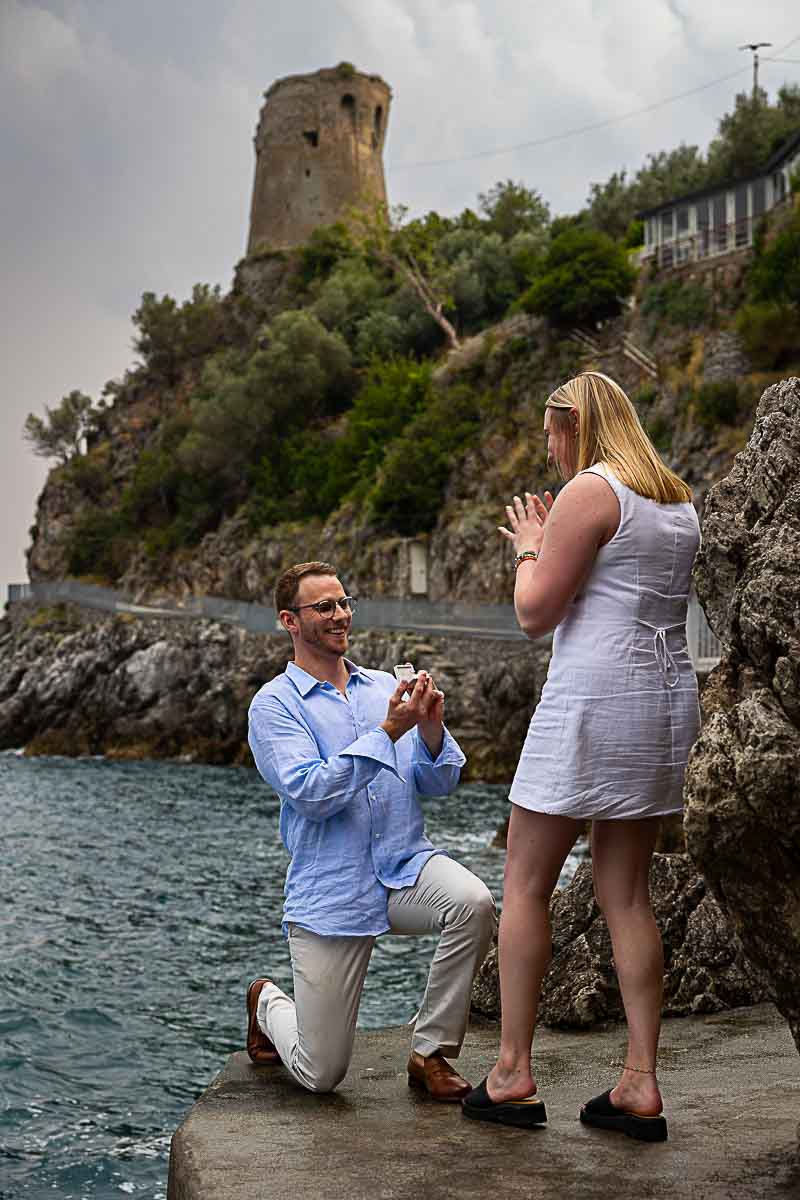 Praiano proposal knee down moment in which he proposes by showing the engagement ring 