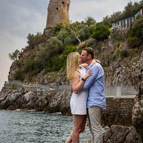 After the big question we took engagement photos in around the coast sideway view of couple kissing