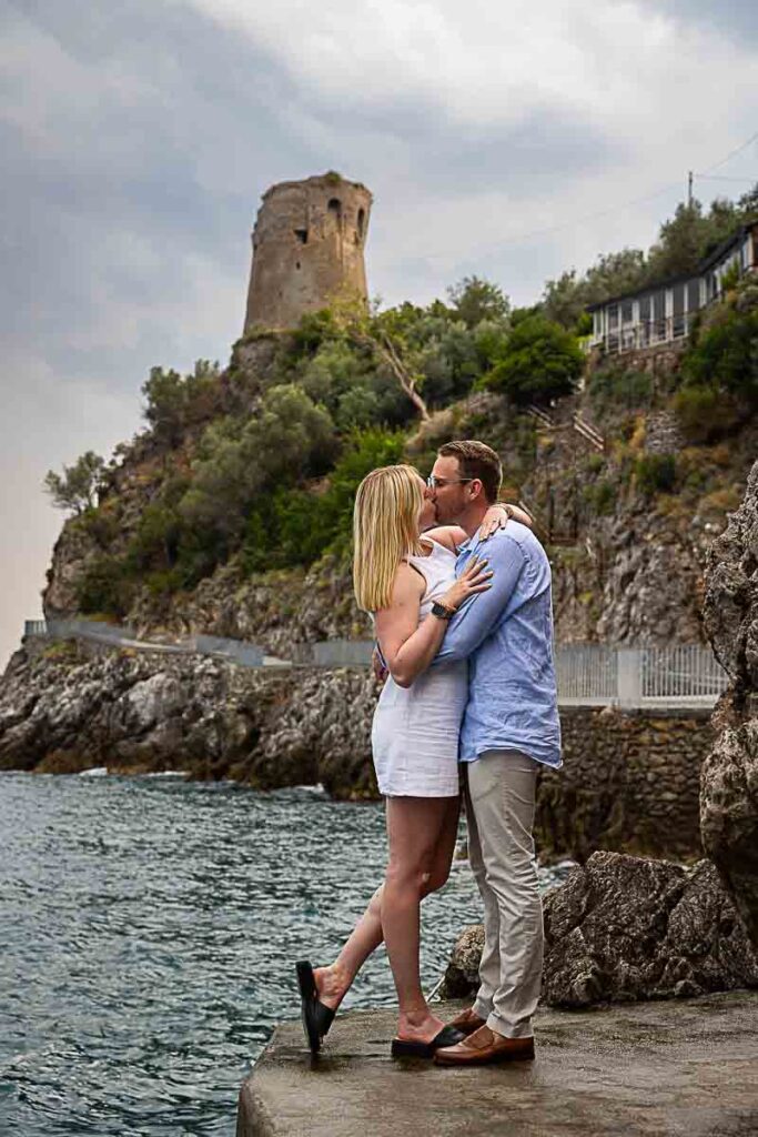 After the big question we took engagement photos in around the coast sideway view of couple kissing