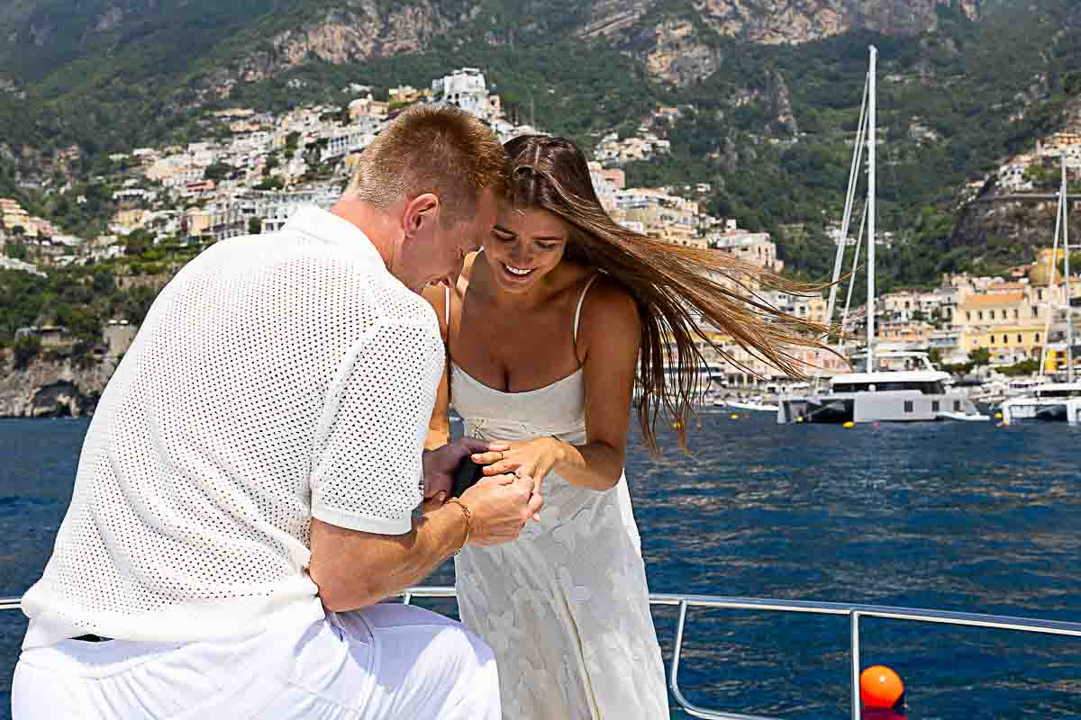 The moment in which he puts on engagement ring on finger 
