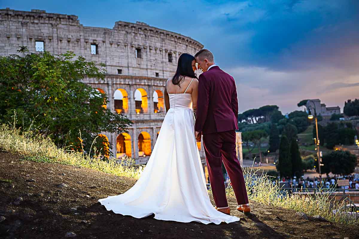 Stunning pictures during the blue hour in Rome during a wedding photoshoot as night started to fall at the Colosseum. Rome, Italy