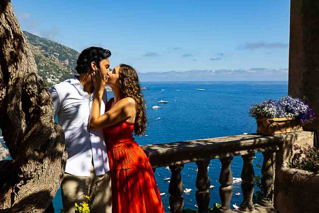 Final kiss captured in stunning photography, set against the breathtaking coastal backdrop at sunset