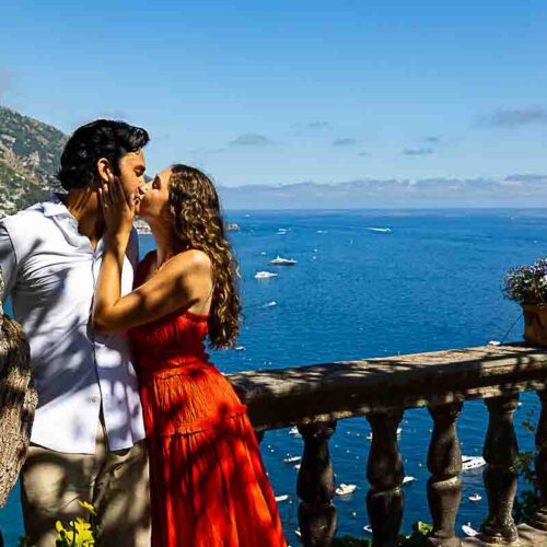 Final kiss captured in stunning photography, set against the breathtaking coastal backdrop at sunset