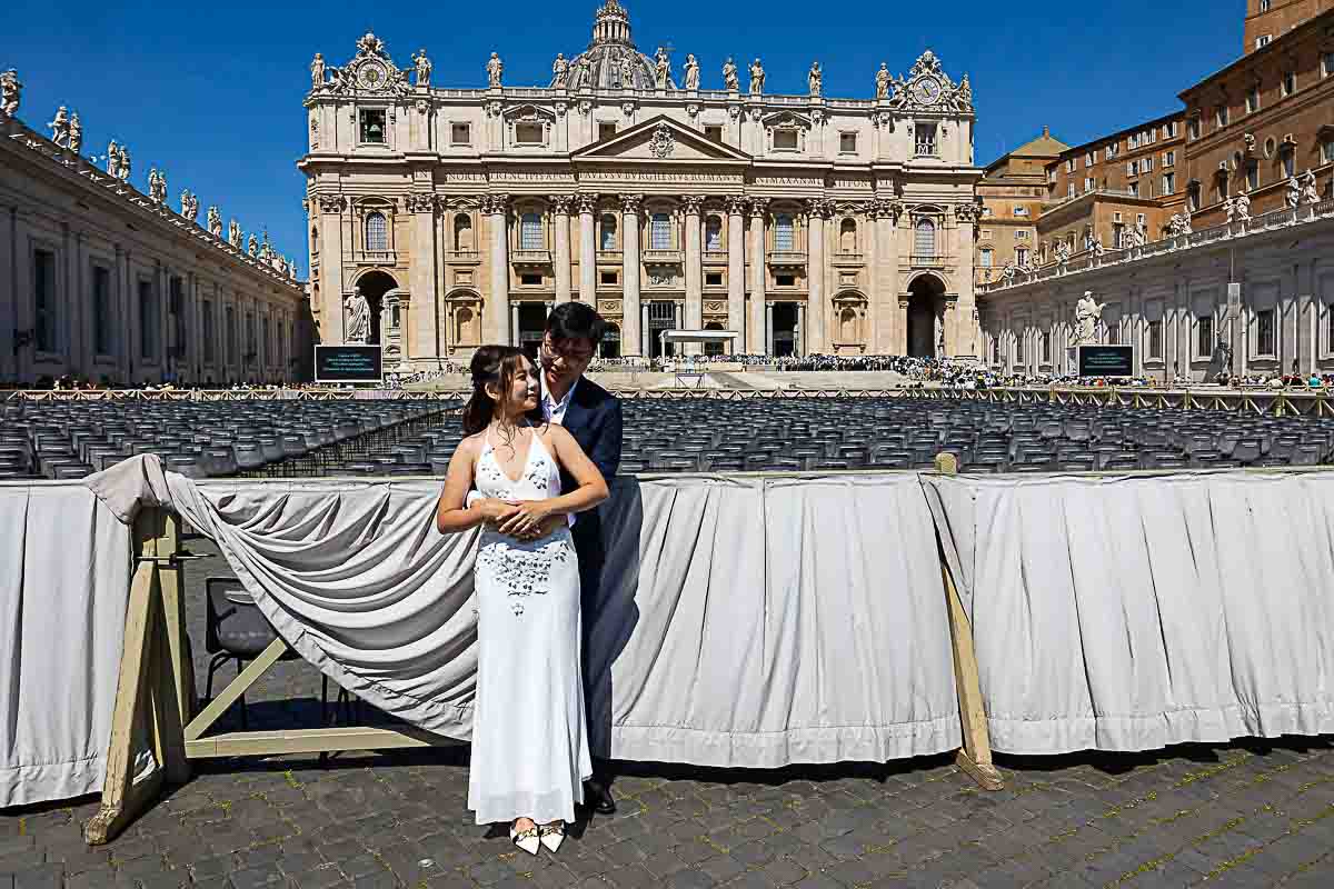 Wedding couple portrait snapped in front of the Saint Peter's basilica facade 