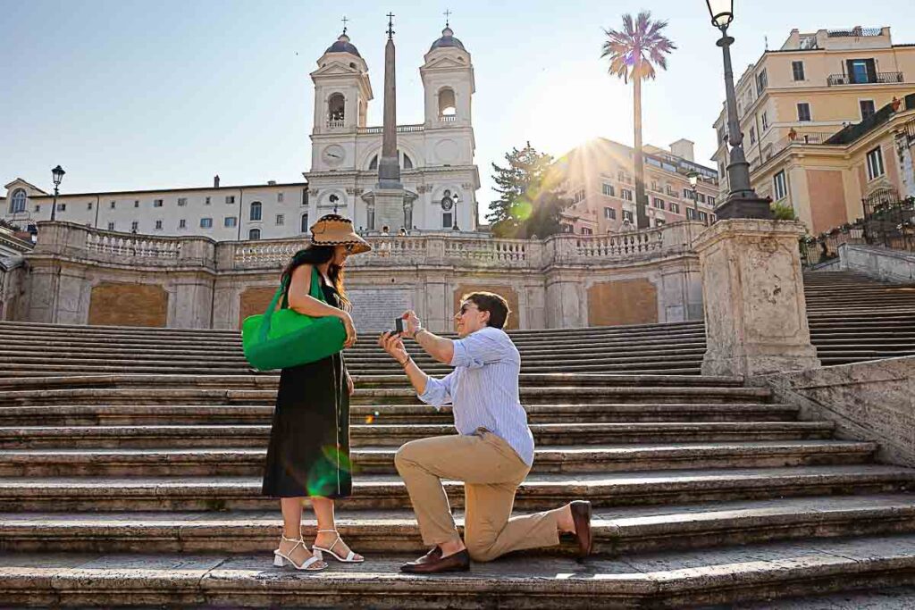 Spanish steps proposal early morning knee down asking the big questions photographed from a distance by a nearby photographer in Rome