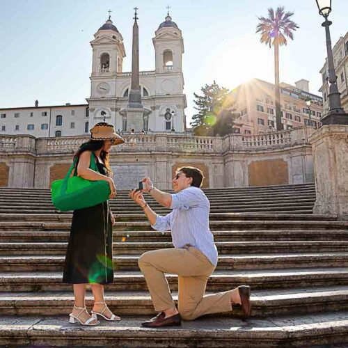 Spanish steps proposal early morning knee down asking the big questions photographed from a distance by a nearby photographer in Rome