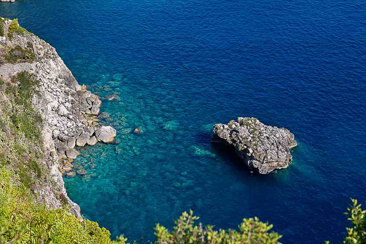 Close up of the fantastic azure emerald green water viewed from the above mountain bird's eye view of the sea 