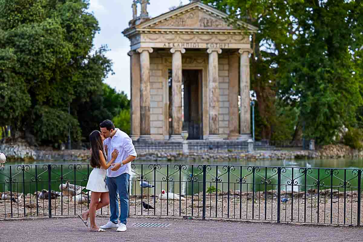After the engagement ring the couple takes some just engaged portrait pictures Villa Borghese Sunrise Proposal