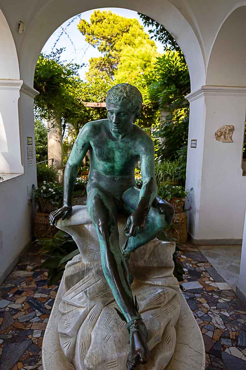 Interior shot of Villa San Michele taking in consideration a statue under portico vertical shot 