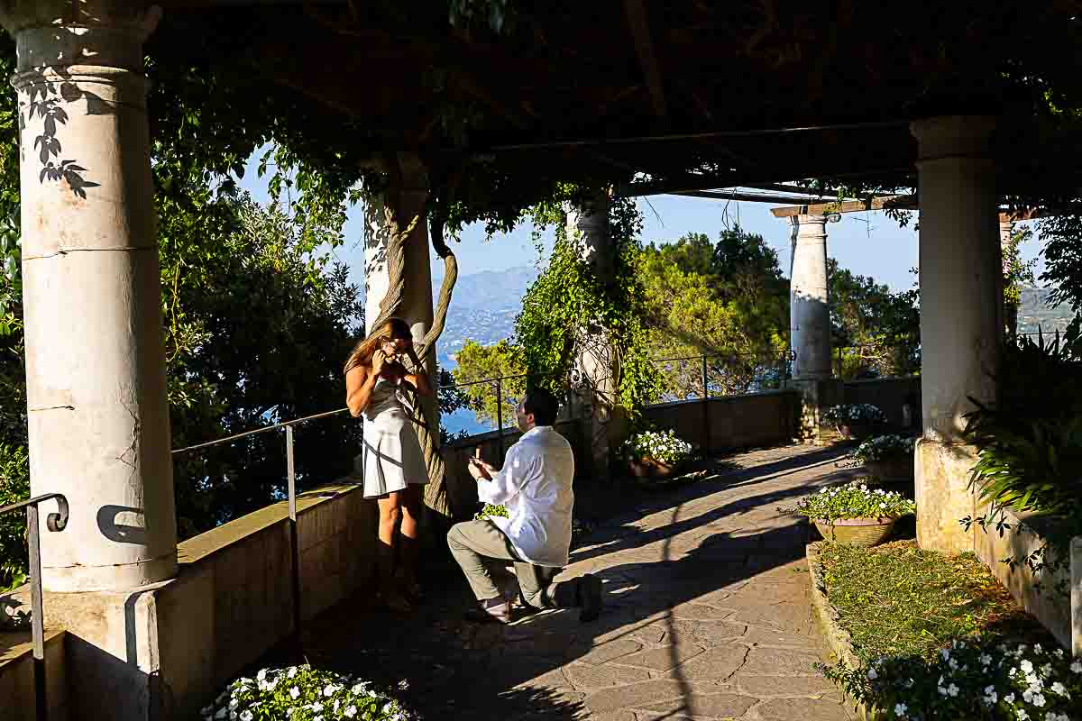Romantic proposal in Capri candidly photographed in Villa San Michele by a professional photographer during an engagement photoshoot 