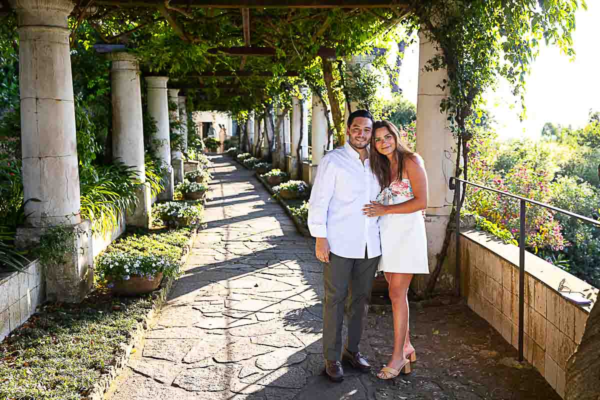 Couple posed for an engagement photo snapped under terrace balcony at sunset Romantic Proposal Capri
