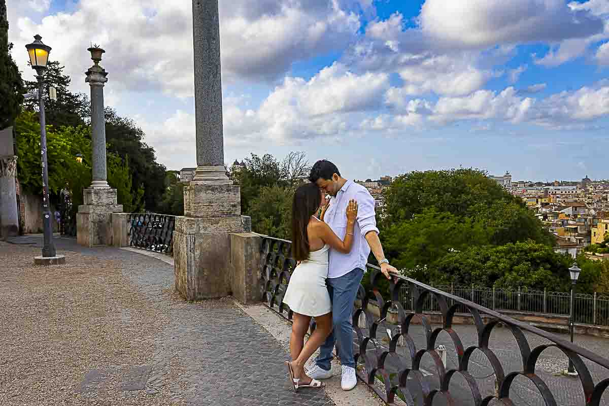 Out of the beaten track image while leaning on the metal fence at the Pincio terrace outlook as they take pictures with the expert photographer from Rome 