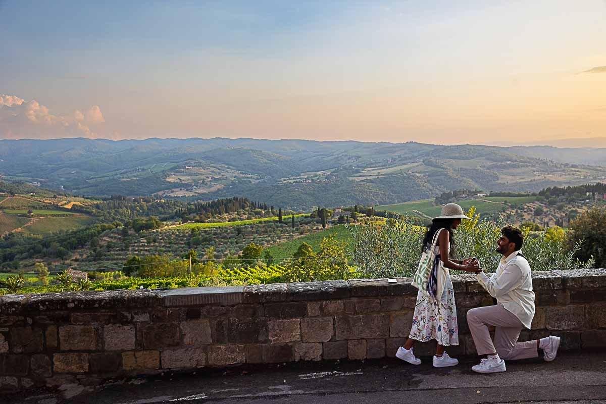 Romantic Proposal in Tuscany before the incredible panoramic view of the Tuscan countryside at sunset 
