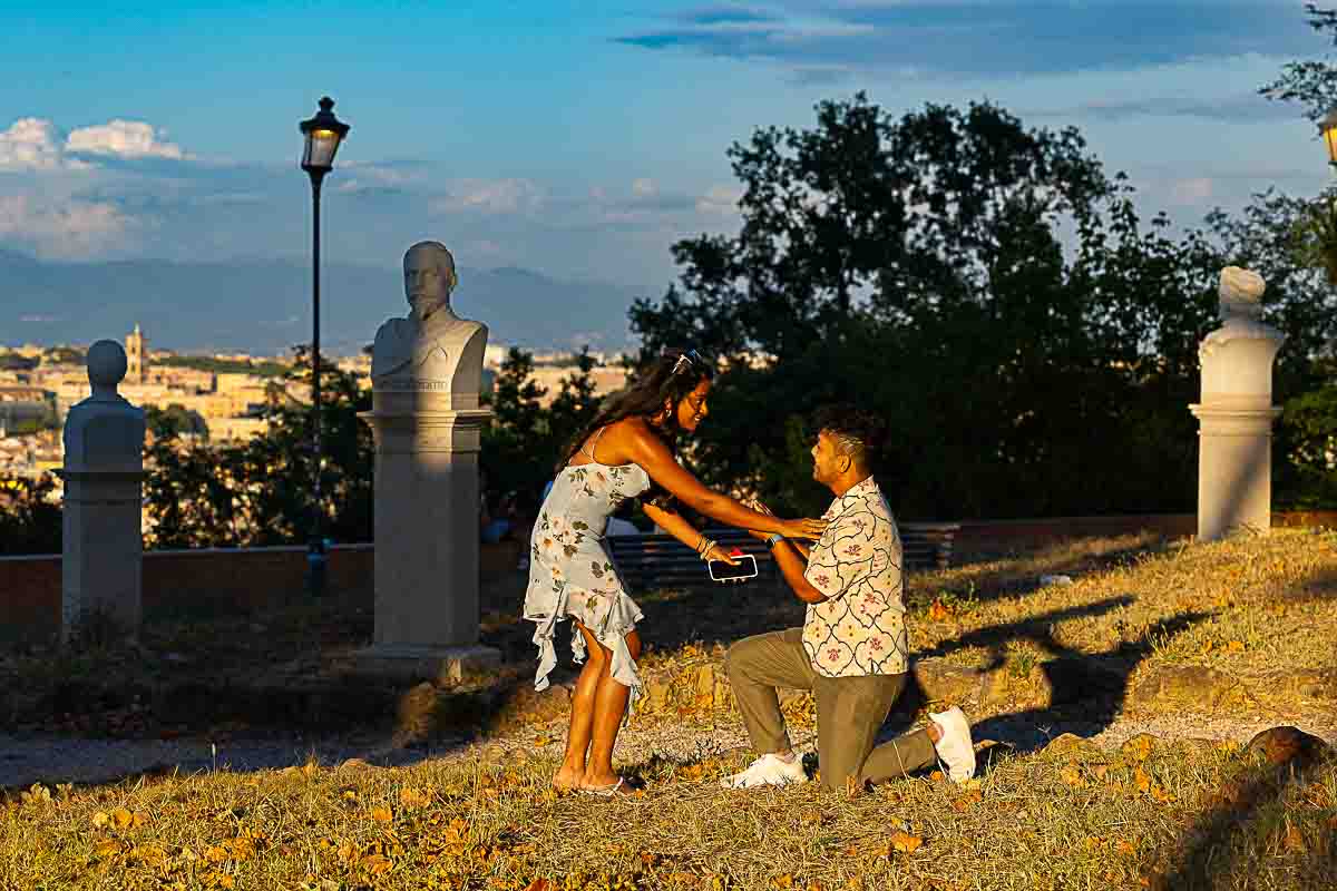 Proposal sunset in Rome Italy happening at the JAniculum hill overlooking the city above at sundown or dusk