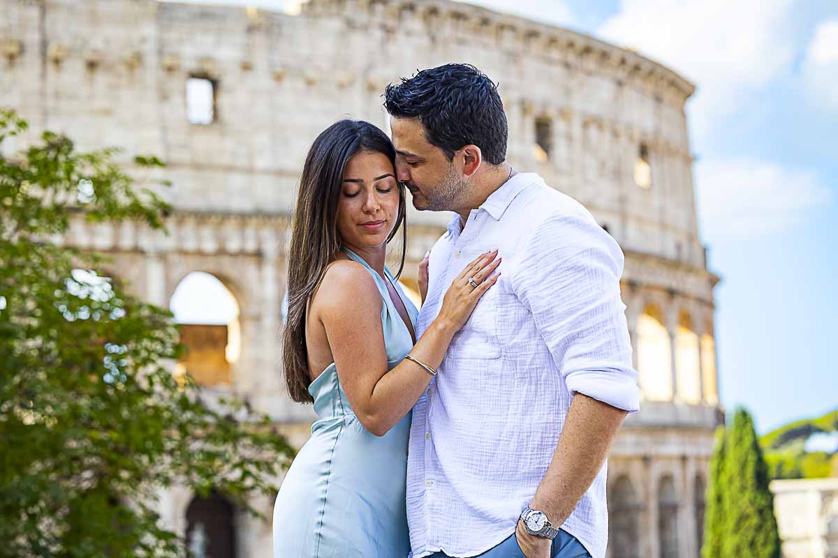 Close-up photographer session. Couple photographed in an ancient landmark called Coliseum