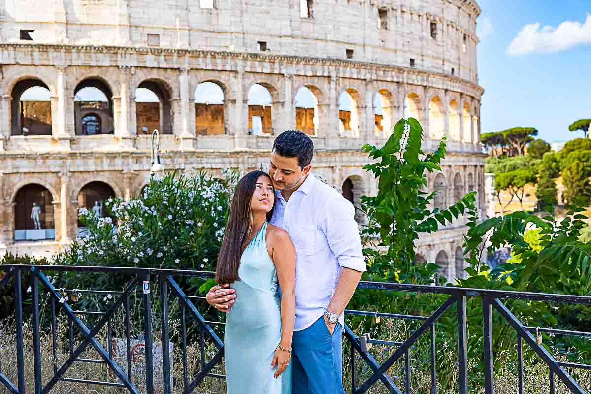 Portrait photographer session in front Roman Colosseum. Rome, Italy.