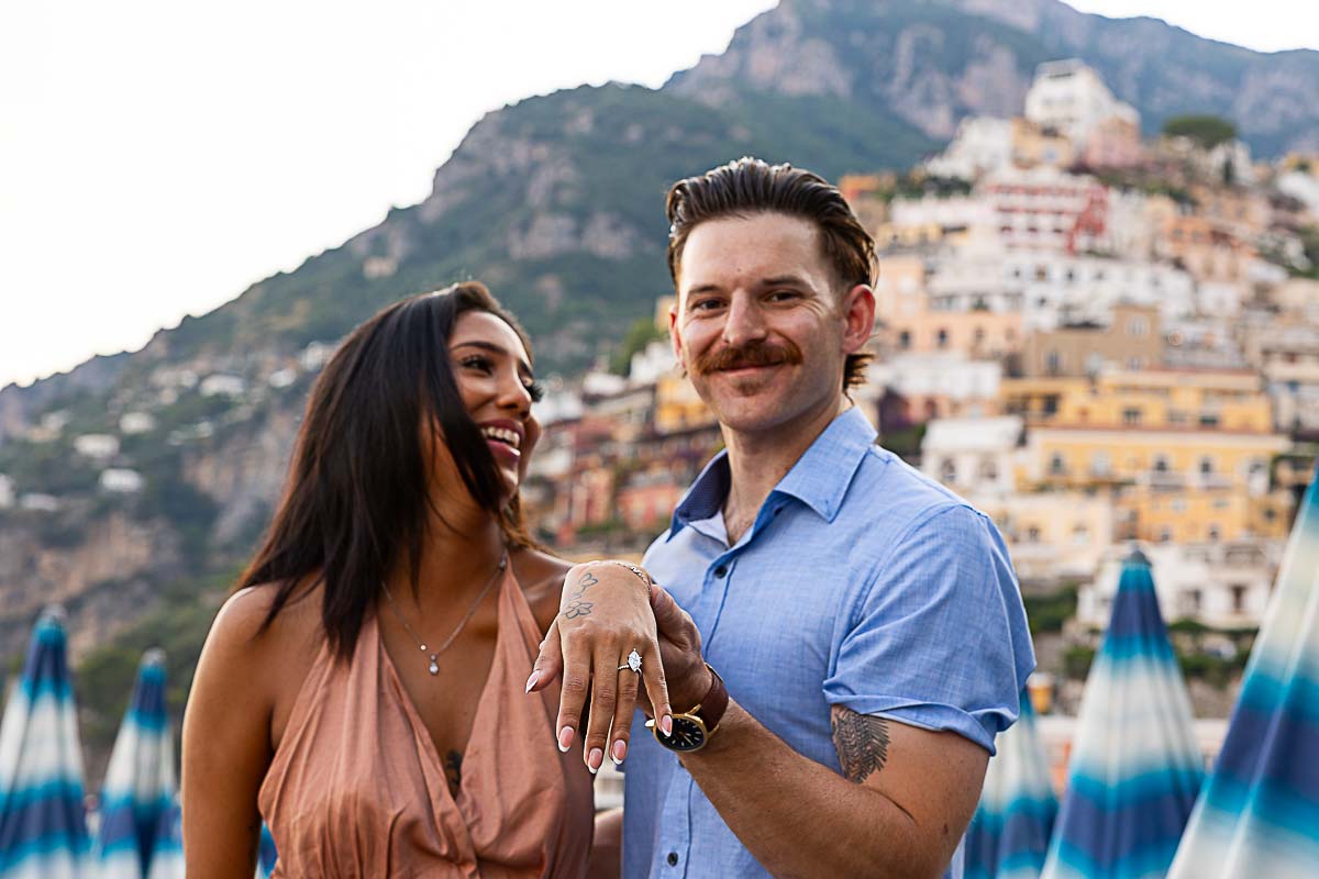 Close up of a couple during an engagement photo session showing the engagement ring while smiling and being together