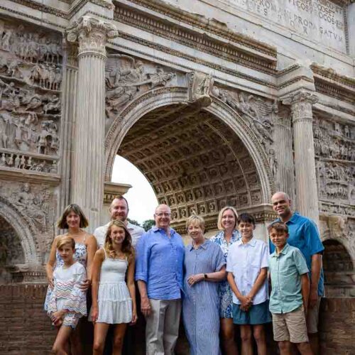 Group photo posing underneath the ancient arch of Septimius Severus contained in the Roman Forum