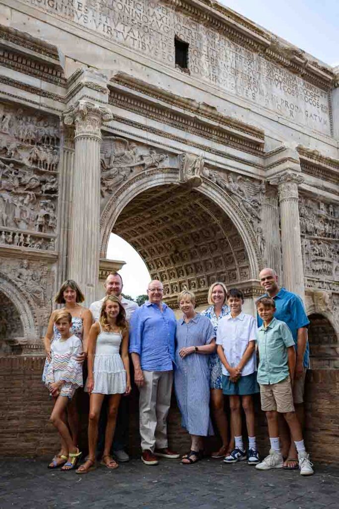 Group photo posing underneath the ancient arch of Septimius Severus contained in the Roman Forum