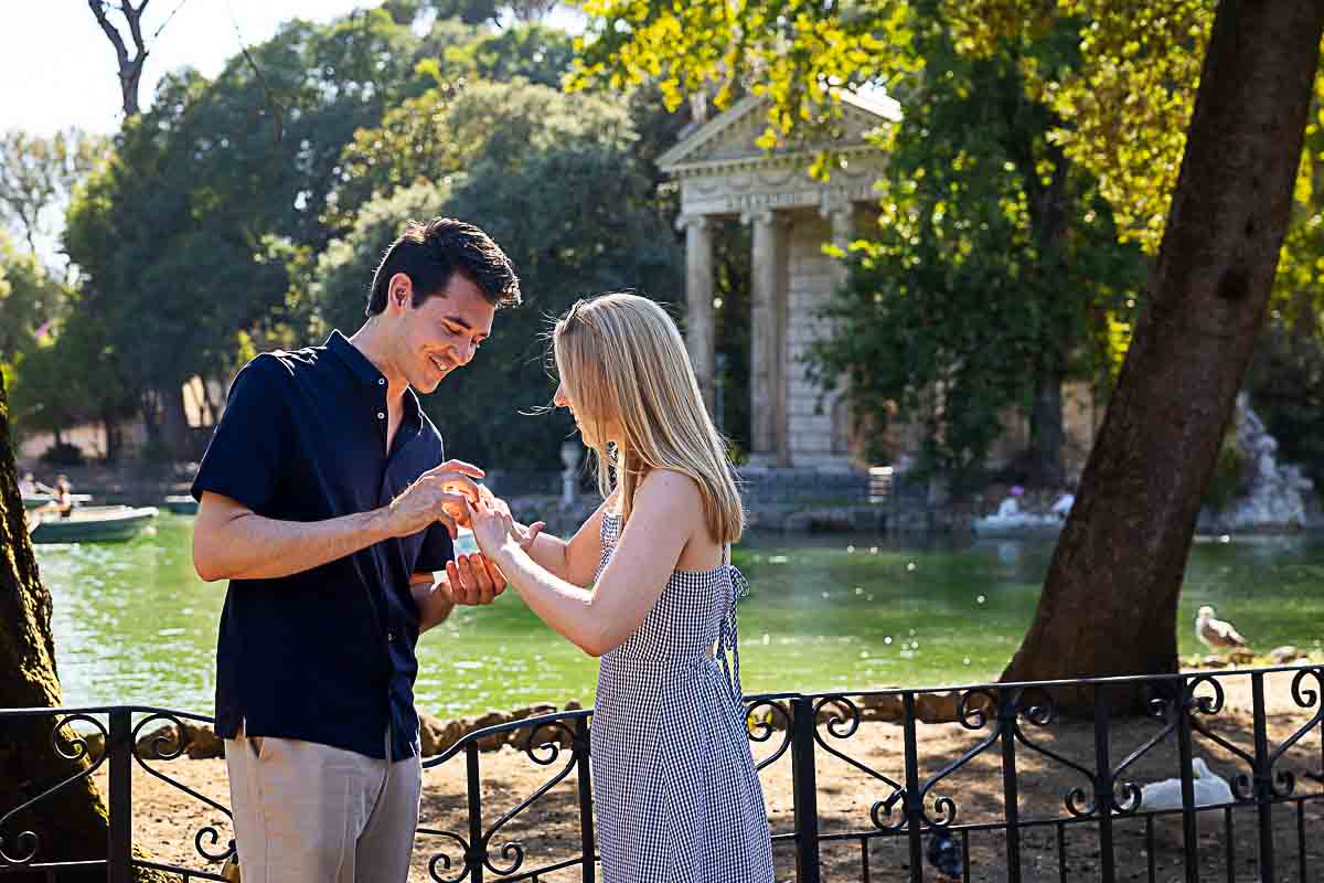The momentin which he puts the engagement ring on her hand and they are officially engaged in Rome 