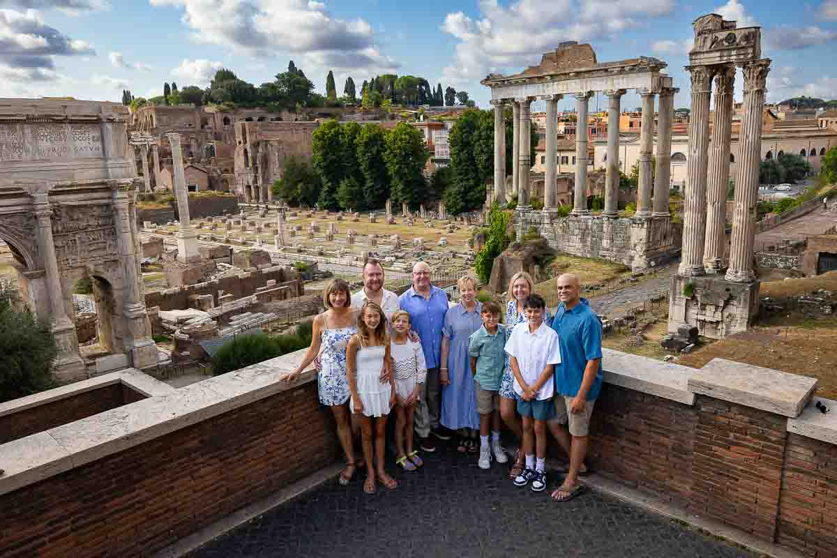 A wide angle sweeping view of the Ancient Forum photographed from above including the ruins and temples in the photography. Rome family walk photoshoot