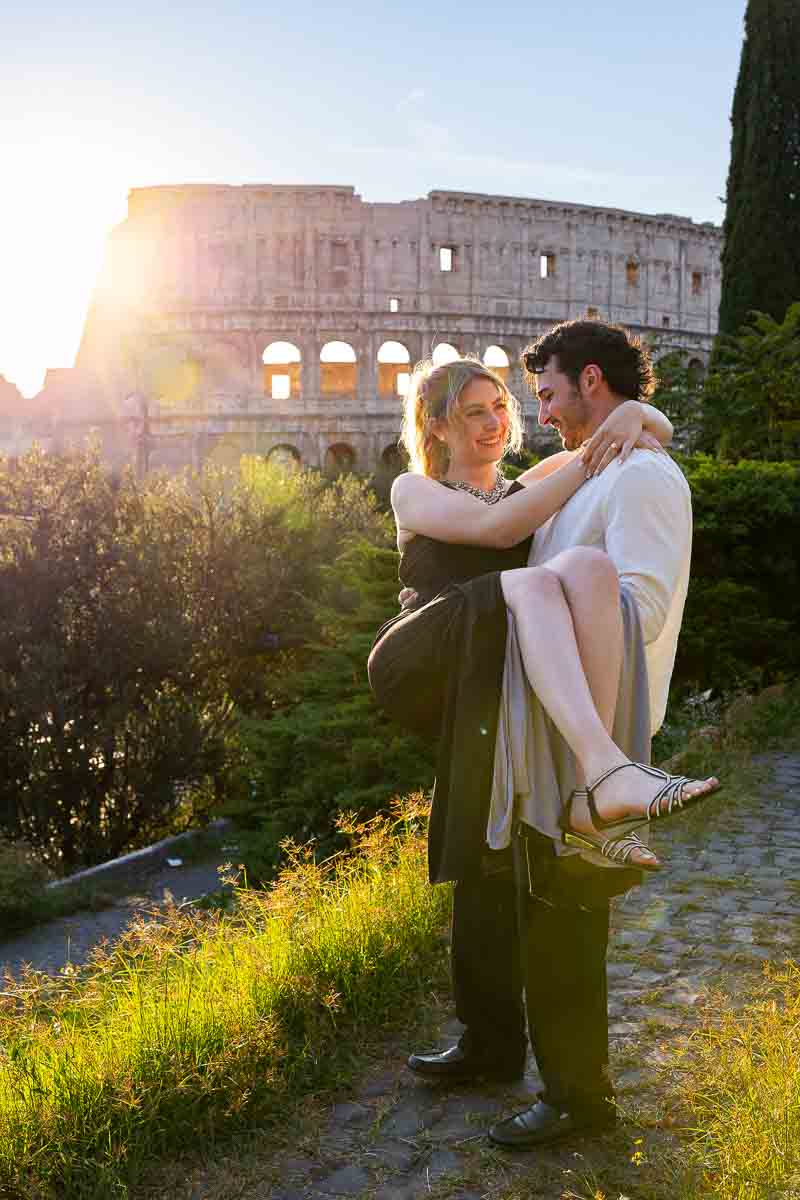Lifted up pose engagement couple during a roman photography session Eternal city
