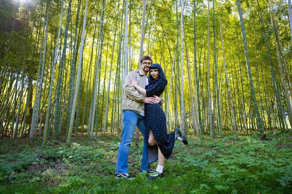 Couple photographer session in a bamboo forest found in the botanical park of the Rome city center in Italy