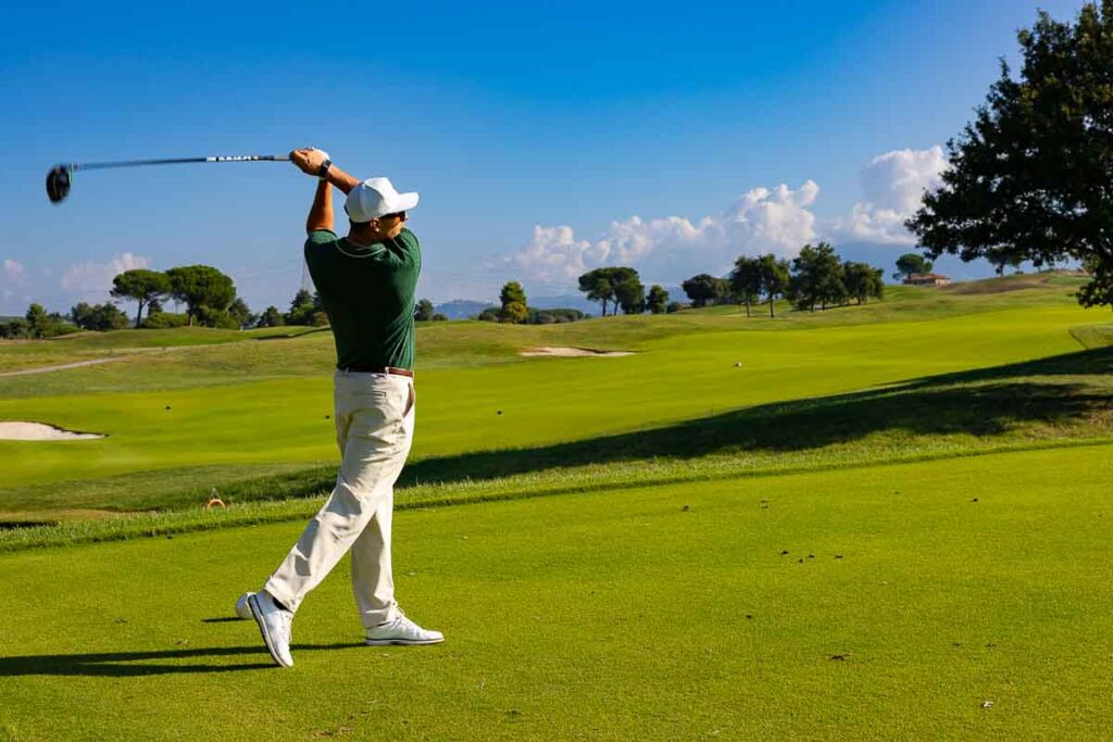 Teeing off at the country club – action shot capturing the start of the hole in sport photography