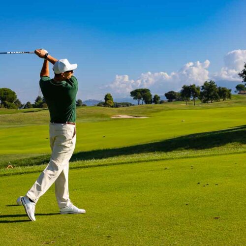 Teeing off at the country club – action shot capturing the start of the hole in sport photography