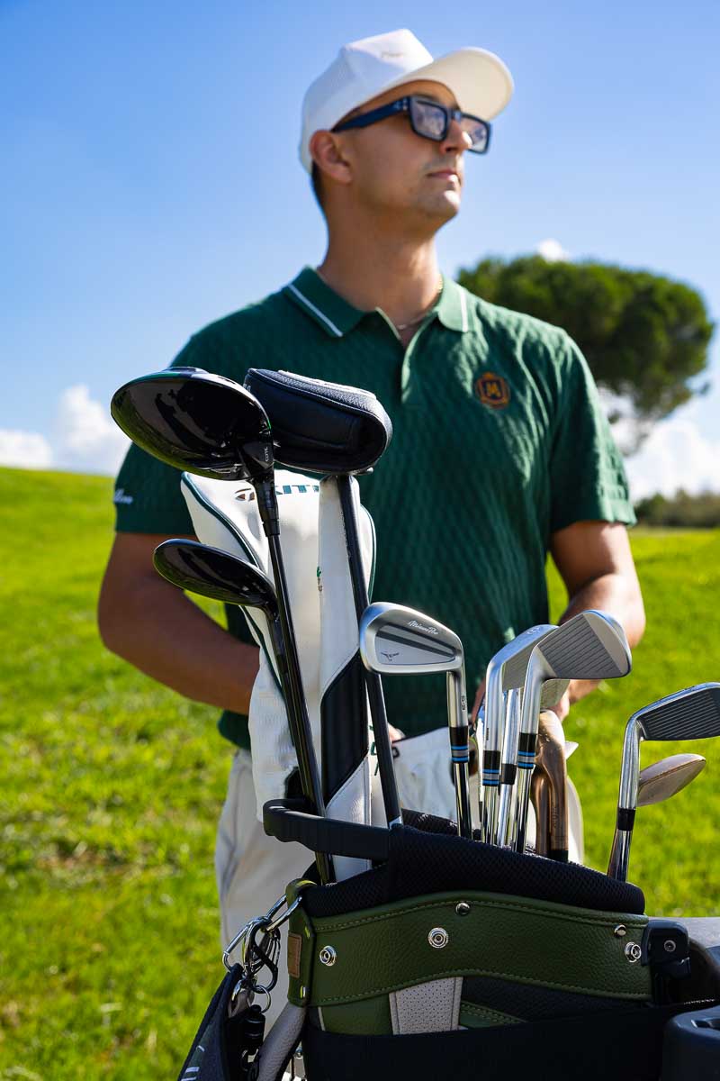 Selecting the right club before the next shot – focused moment showing preparation and attention to detail on the fairway