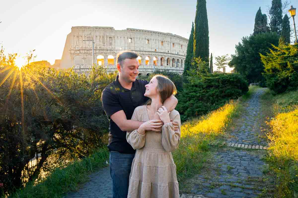 Portrait pictures just engaged at sunset in Rome in front main landmark
