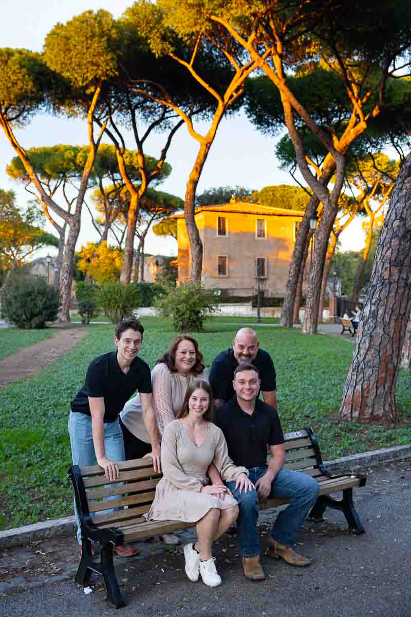 Group family all together for picture taking in a typical roman park in Italy